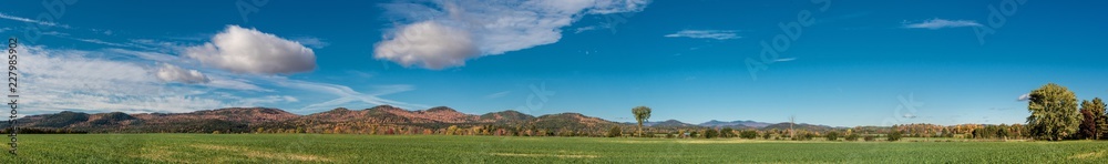 Panoramic view of a land near Adirondack Mountains in early fall