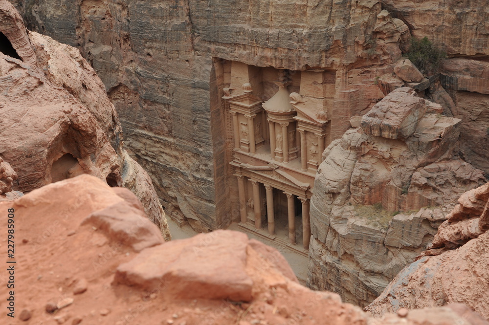 Al-Khazneh called The Treasury is one of the most elaborate temples in the ancient Arab Nabatean Kingdom city of Petra. This structure was carved out of a sandstone rock face. Al-Khazneh called The Treasury is one of the most elaborate temples in the ancient Arab Nabatean Kingdom city of Petra. This structure was carved out of a sandstone rock face.