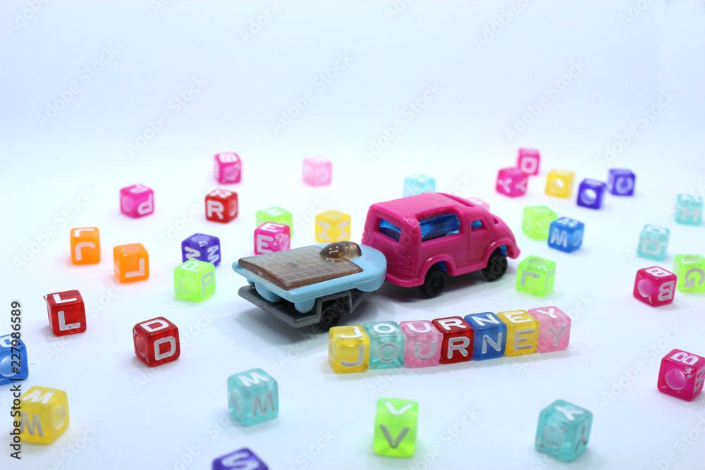 Obraz premium toy car on white background with journey word