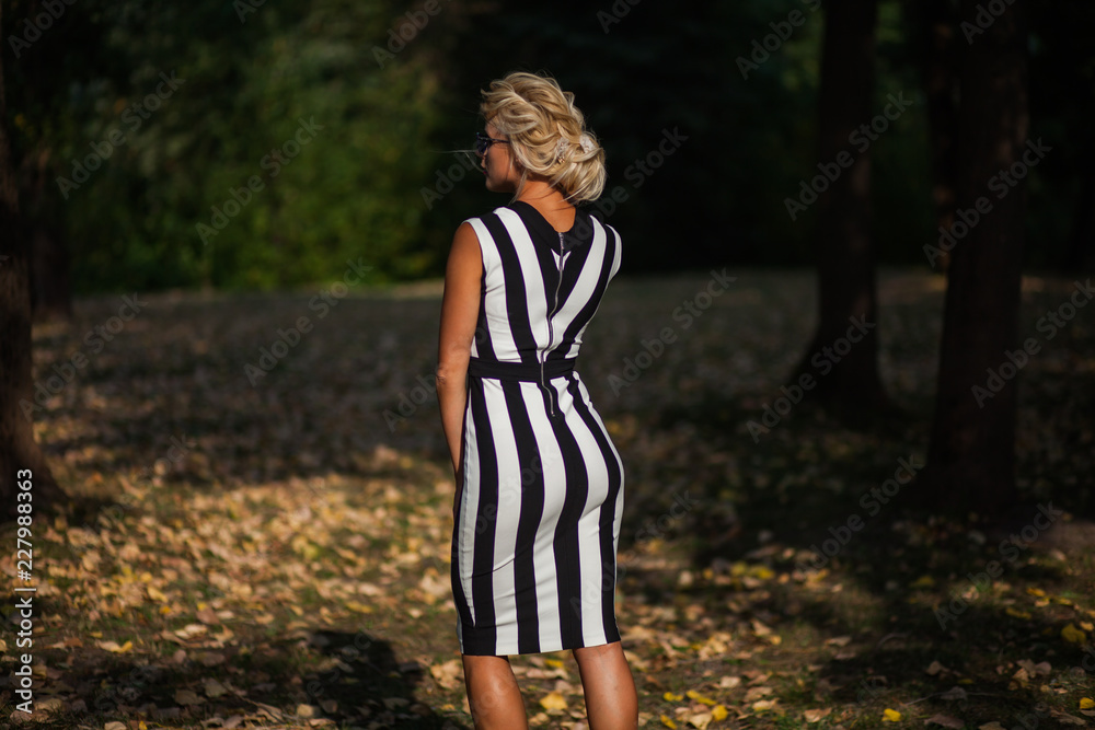 beautiful blonde woman in the autumn forest at sunset beautiful blonde woman in the autumn forest at sunset
