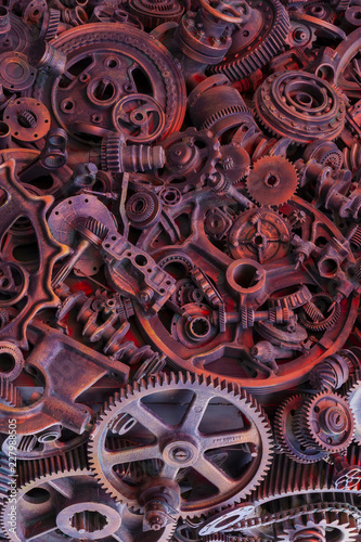 Steampunk background, machine parts, large gears and chains from machines and tractors.