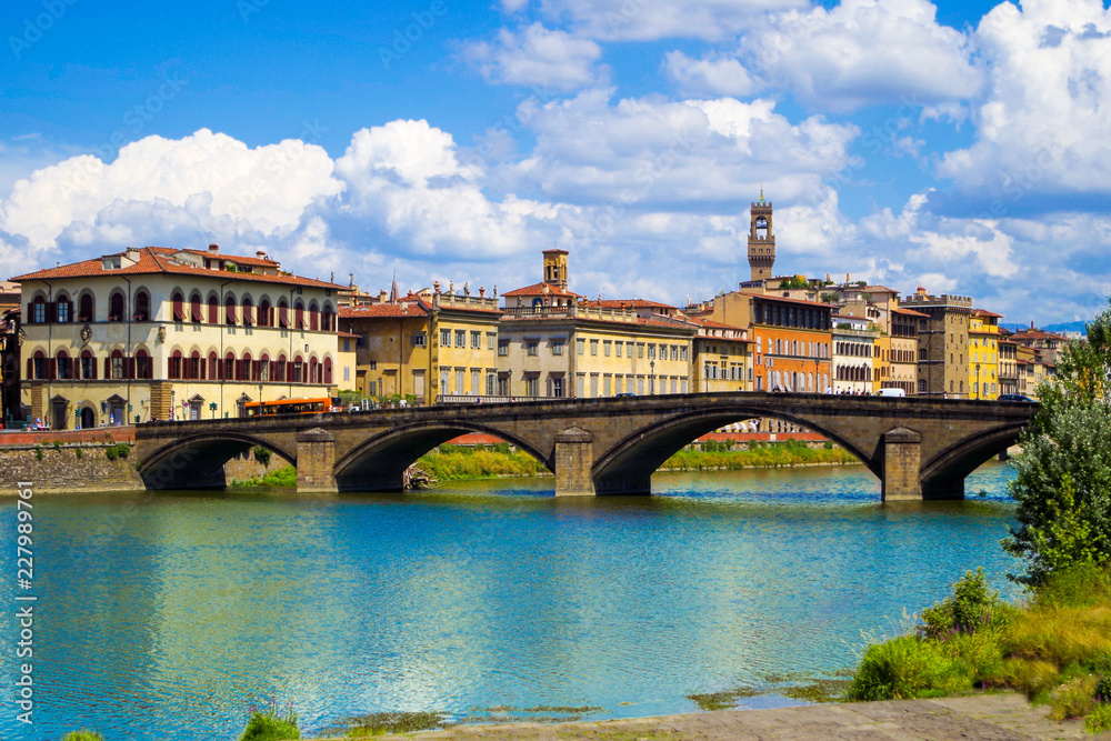 Florence or Firenze, a view of the Arno River and the Ponte Santa Trinita Bridge Florence or Firenze, a view of the Arno River and the Ponte Santa Trinita Bridge