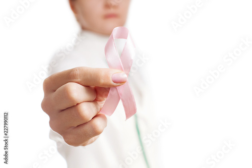 Medic holding pink ribbon isolated on white. Pink ribbon. Symbol of breast cancer awareness. National Breast Cancer Awareness Month. Mammography Day.