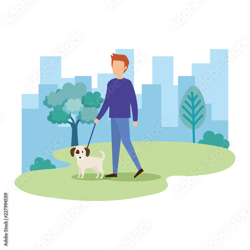 young man with dog in the park