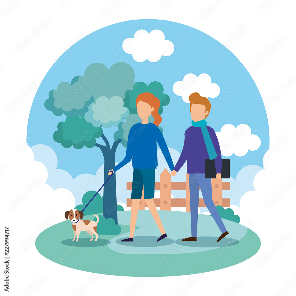 young couple with dogs in the park