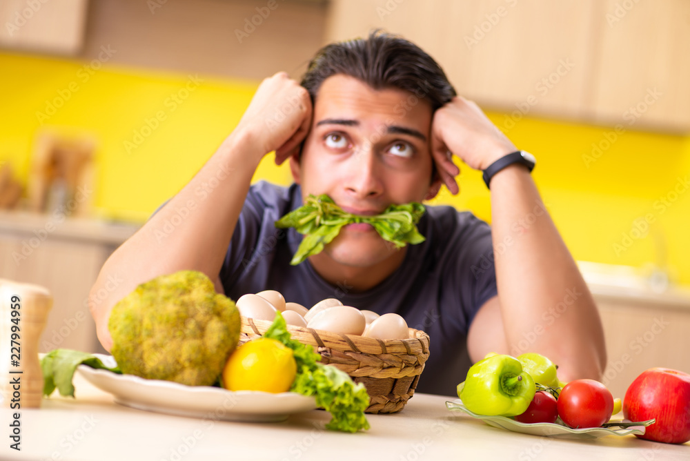 Young man in dieting and healthy eating concept Young man in dieting and healthy eating concept