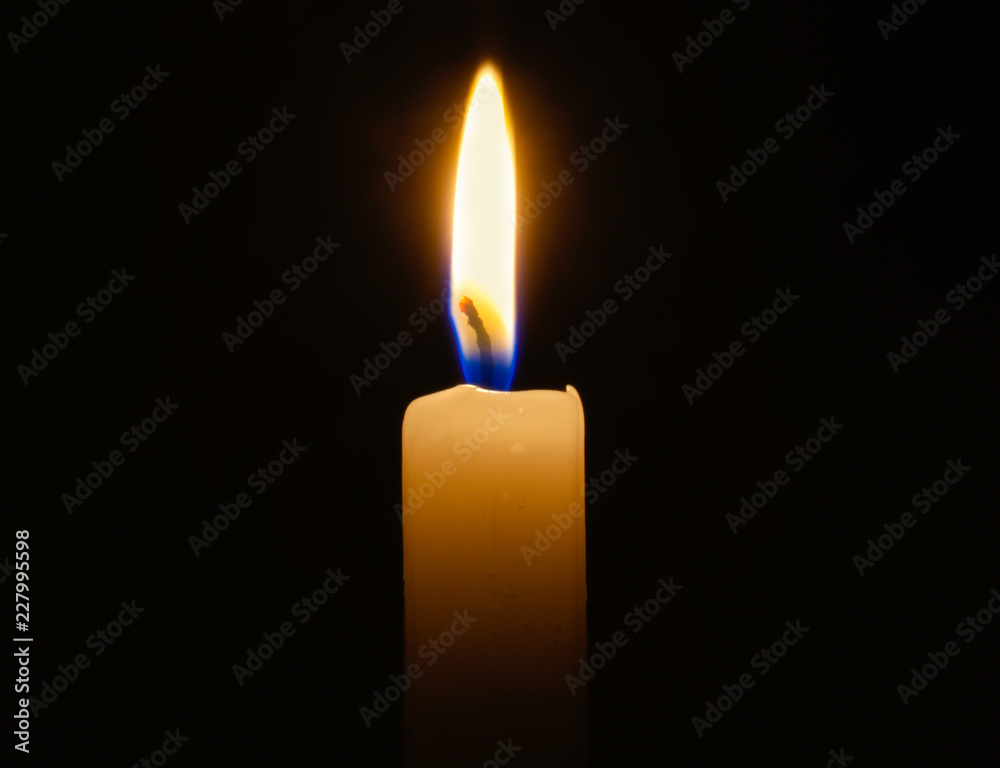 candle lit in darkness with high detail and focus. candle lit in darkness with high detail and focus.