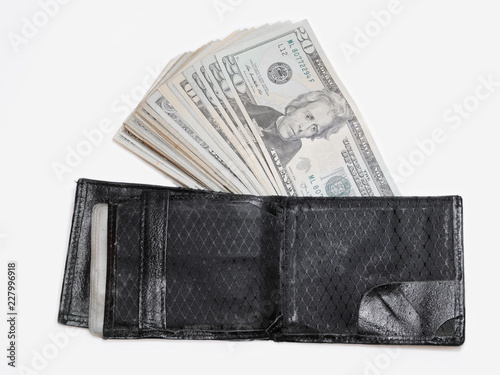 wallet with a lot money and dollar bills of various values.
