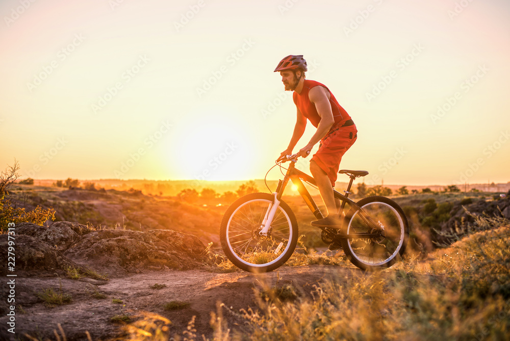 Fototapeta premium Extreme cycling, mountain biking on the rocks, free space.