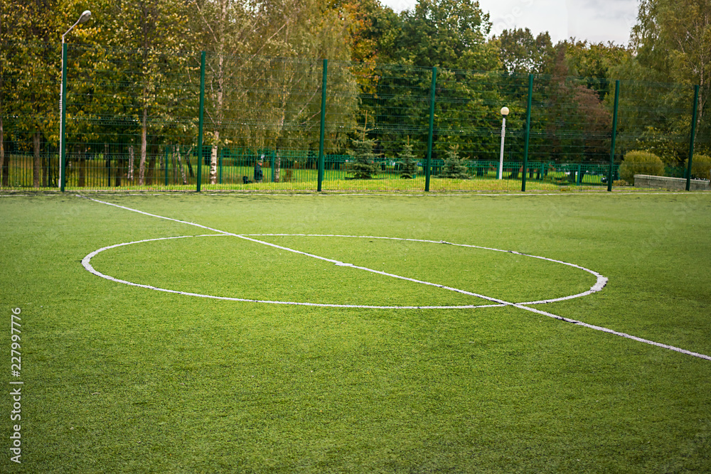 football field in a city public park, field center
