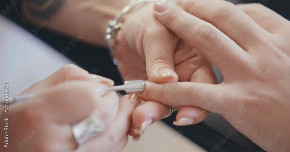 Close up of male hands getting manicure