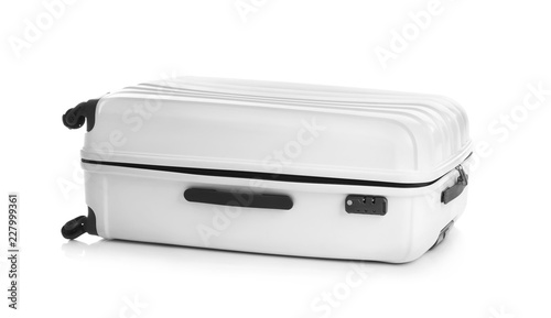Modern suitcase for travelling on white background