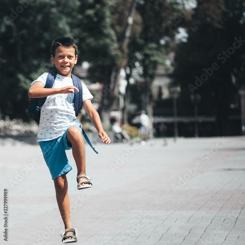 the boy runs to school