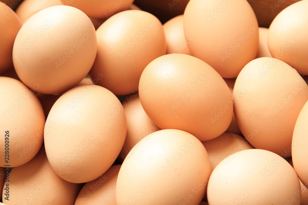 Pile of raw brown chicken eggs, closeup Pile of raw brown chicken eggs, closeup