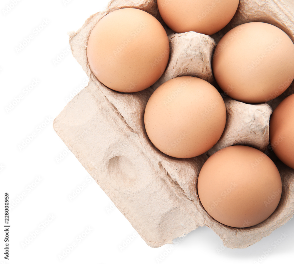 Carton of raw chicken eggs on white background, top view Carton of raw chicken eggs on white background, top view