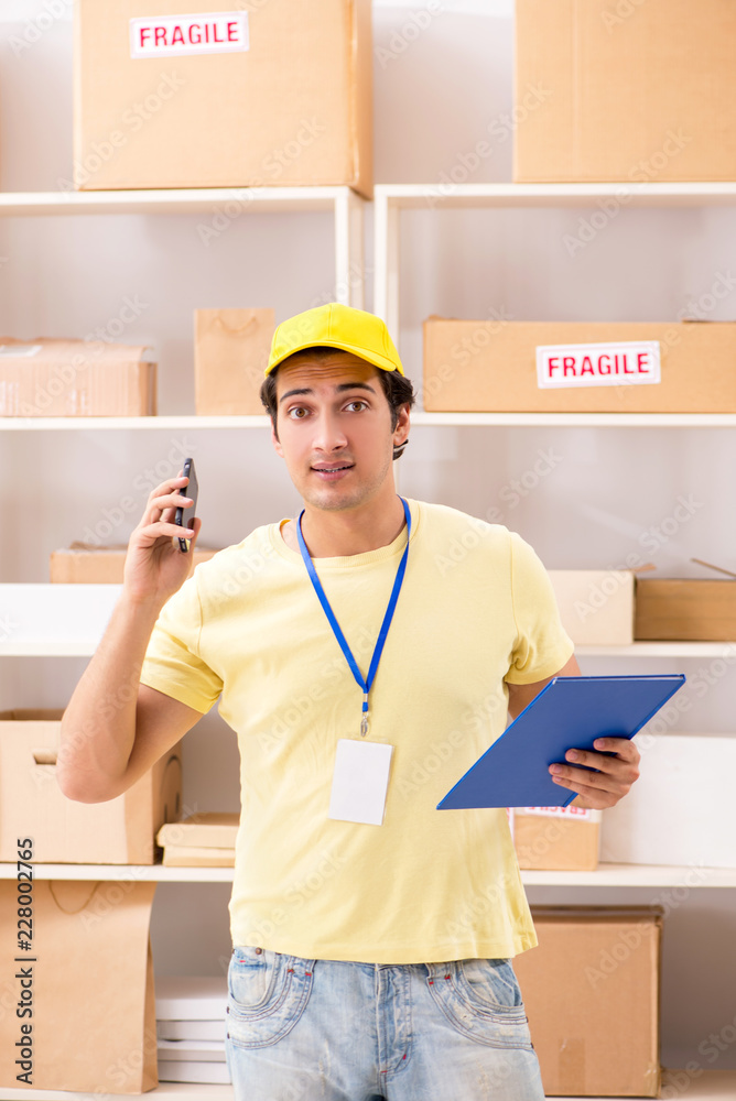 Handsome contractor working in box delivery relocation service Handsome contractor working in box delivery relocation service