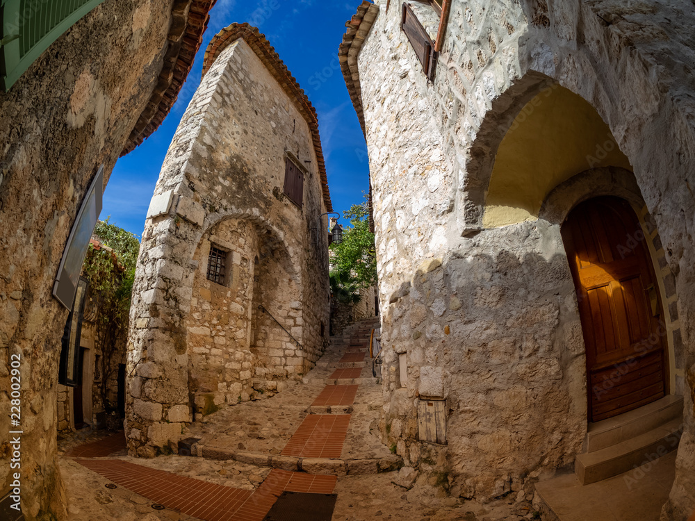 Medieval architecture inside Eze citadel and village, with walls made of stones, in Nice in France