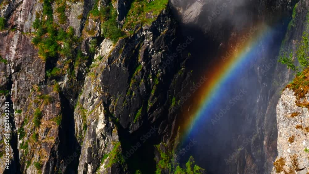 Rainbow in in rocky mountains in summer, Mabodalen valley Norway. National tourist Hardangervidda route Rainbow in in rocky mountains in summer, Mabodalen valley Norway. National tourist Hardangervidda route