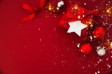 Christmas and New Year holiday background. Xmas greeting card. Christmas gifts on red background top view.