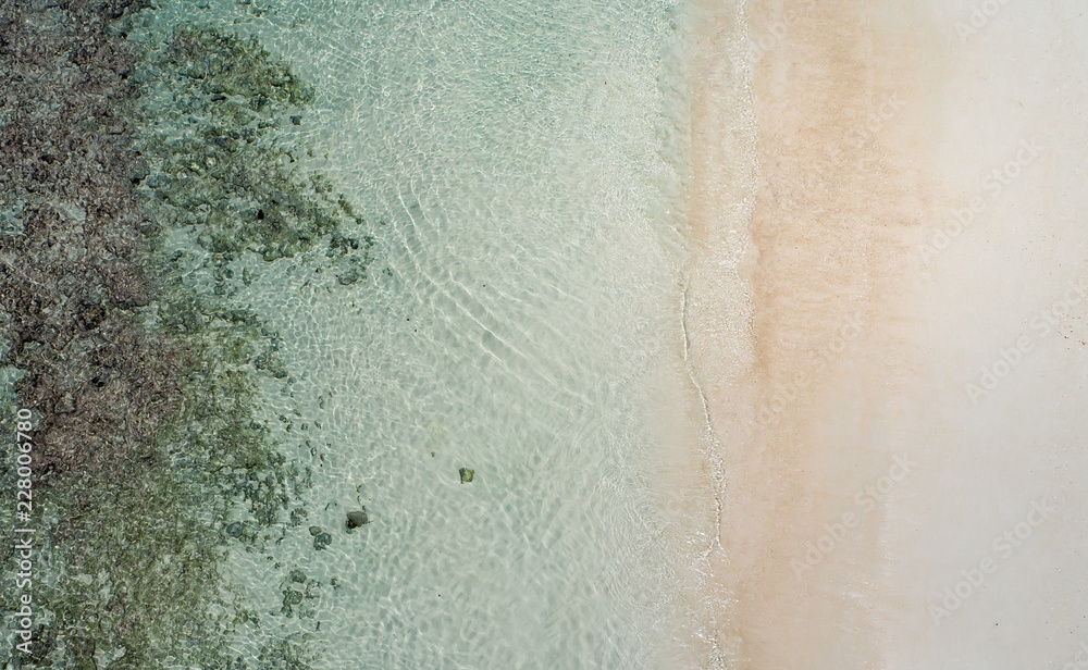 Beautiful tropical white empty beach and sea waves seen from above. Seychelles beach aerial view Beautiful tropical white empty beach and sea waves seen from above. Seychelles beach aerial view