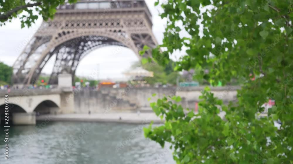 Defocused background of the Eiffel Tower on the Seine River in Paris Defocused background of the Eiffel Tower on the Seine River in Paris