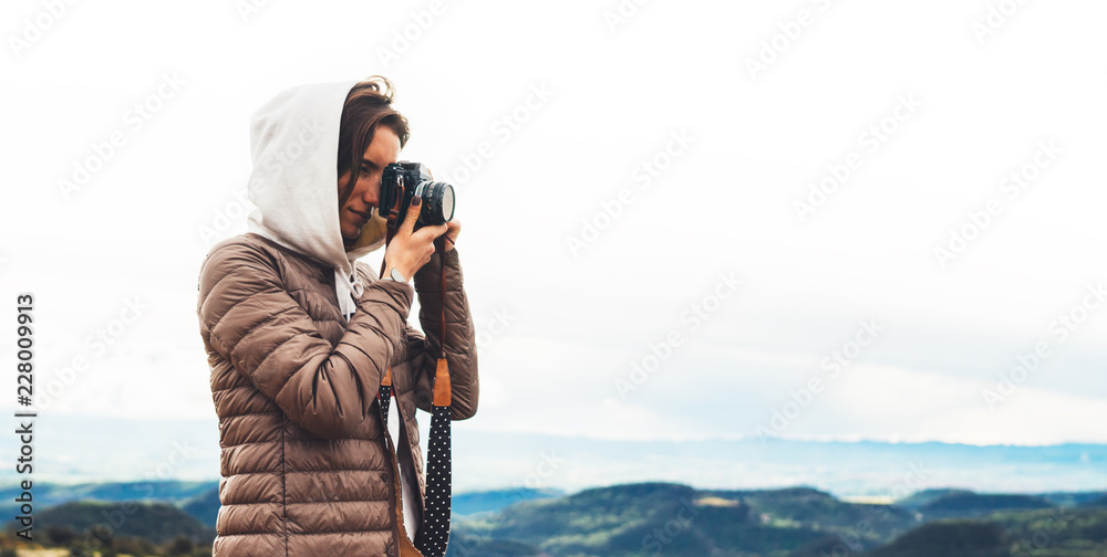 Obraz premium photographer traveler on top mountain, tourist looking holding in hands digital photo camera, hiker taking click photography, girl enjoy nature panoramic landscape in trip, relax holiday hobby concept