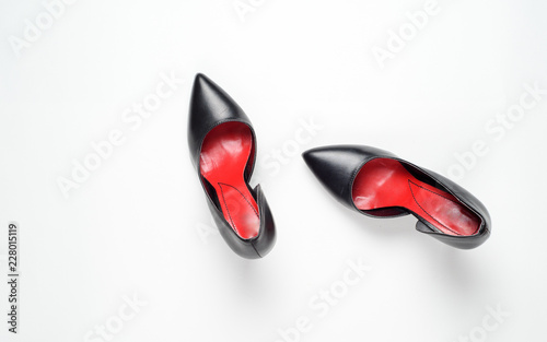 Black woman shoes on white background. Flat lay, top view trendy fashion feminine background. Beauty blog concept.
