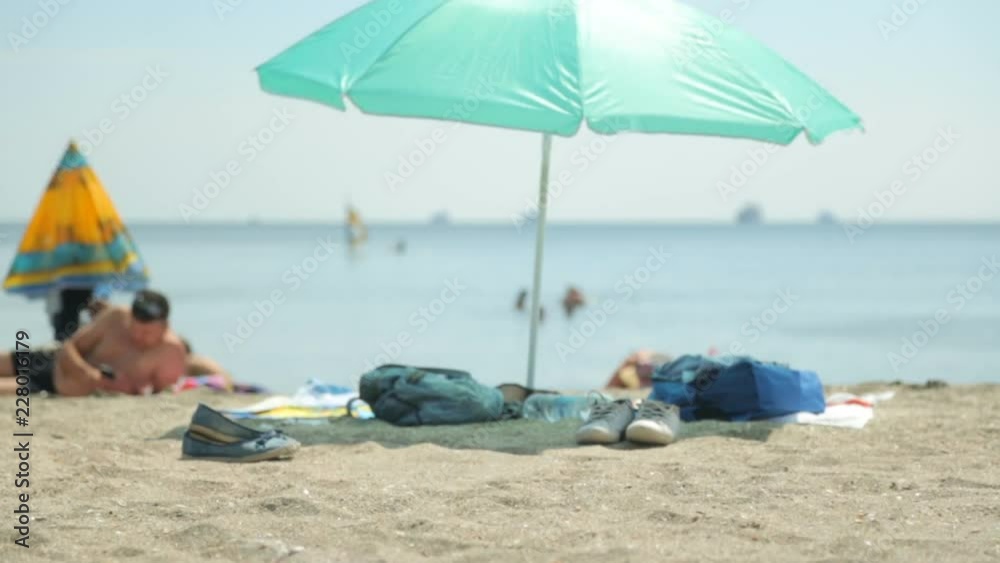 People on beach in hot summer day People on beach in hot summer day
