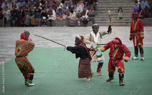 Clowns chased off during masked dance festival photo