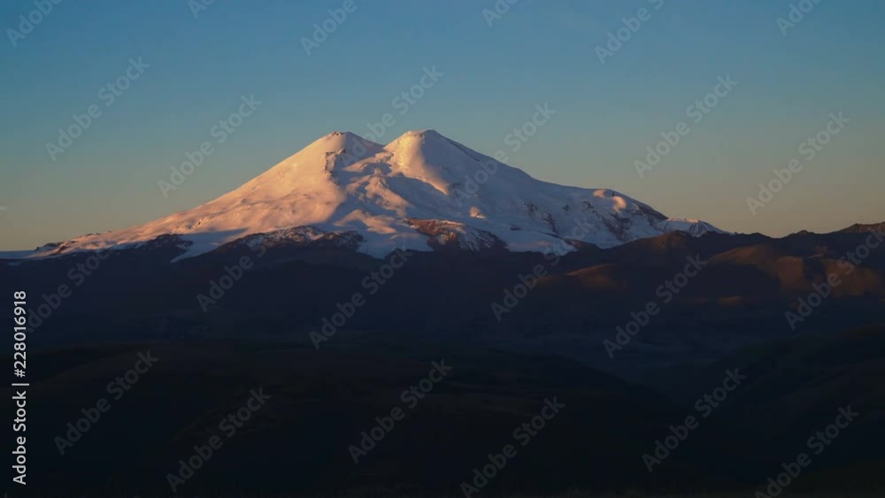 Timelapse - beautifull landscape view of the mount Elbrus at sunrise - the highest mountain in Europe. Caucasus mountains at autumn season time. Timelapse - beautifull landscape view of the mount Elbrus at sunrise - the highest mountain in Europe. Caucasus mountains at autumn season time.