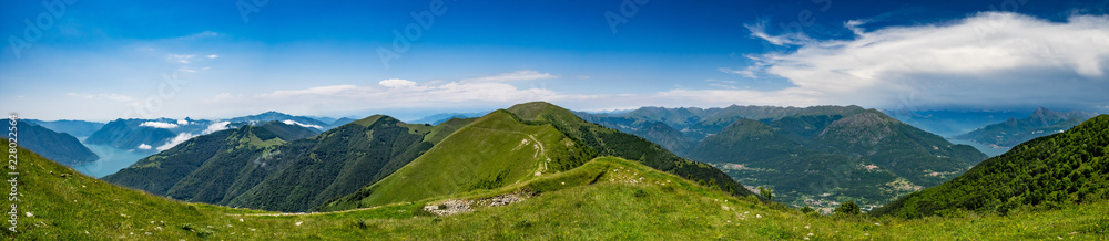 Panoramic view of Monte Galbiga, Lake Como, Lake Lugano and surrounding mountains as seen from Monte Tremezzo