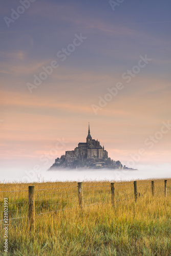 Fotografie, Obraz beautiful colorful foggy morning around old castle in Normandy in France