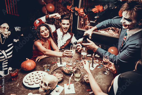 Canvas Print Young People Wearing Costumes Drinking Champagne