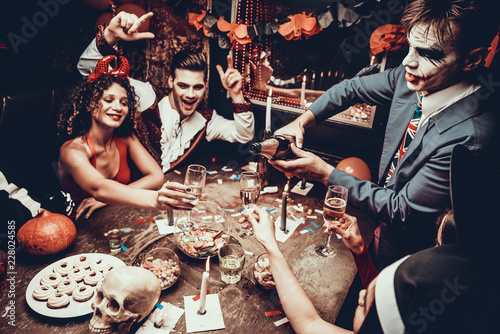 Sticker Young People Wearing Costumes Drinking Champagne