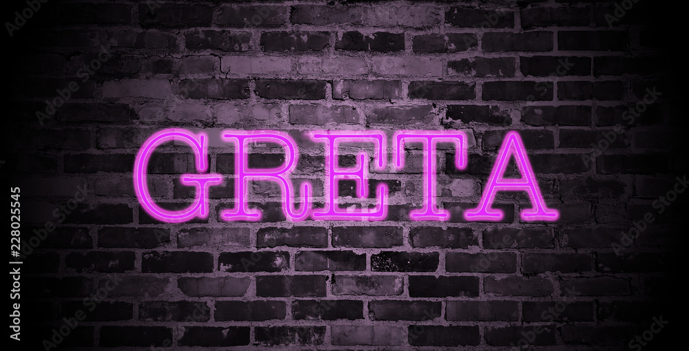 first name Greta in pink neon on brick wall