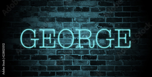 first name George in blue neon on brick wall