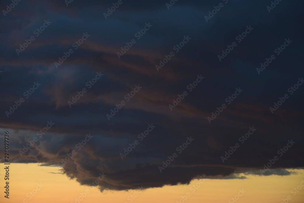 Dark cloud formation at dusk