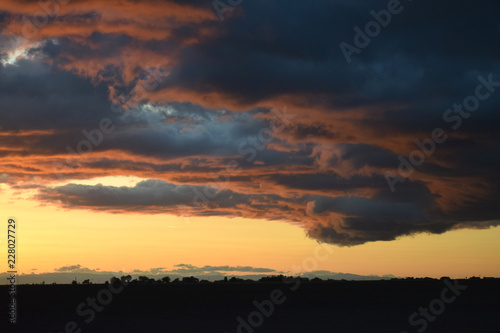 Dark cloud formation at dusk © Claude