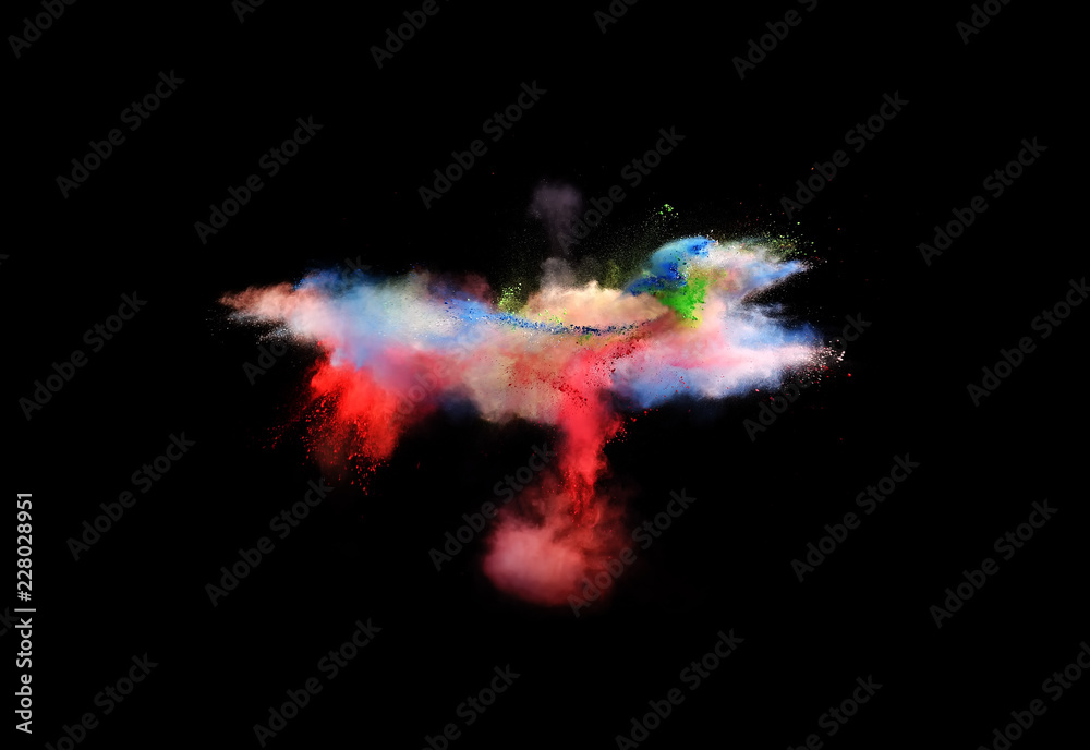 Obraz premium Bizarre forms of powder paint and flour combined together explode in front of a black background to give off fantastic multi colored cloud forms.