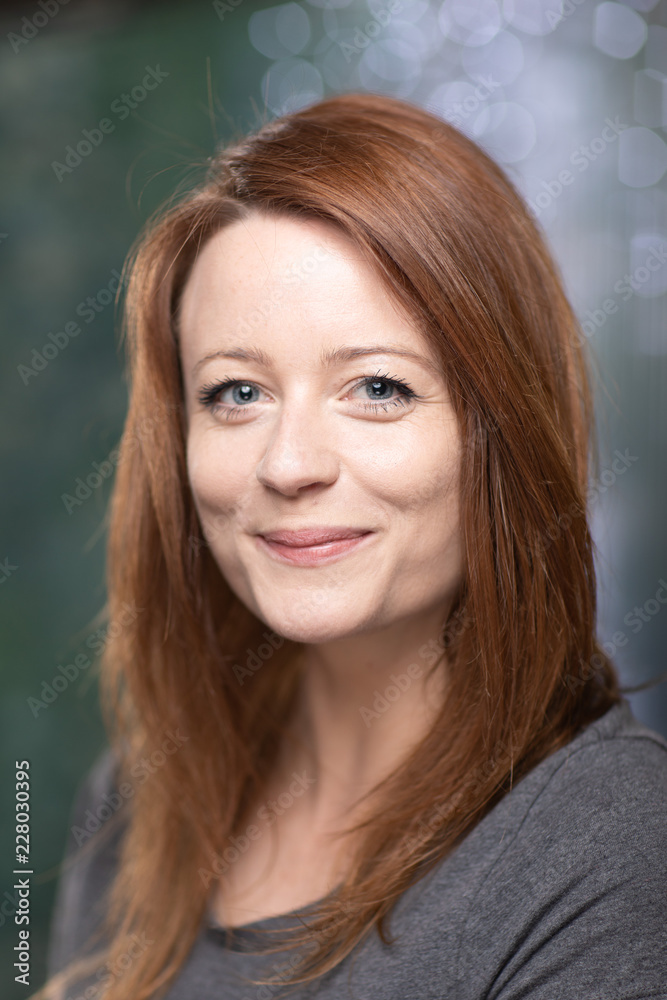 Portrait of white skin ginger girl with blue eyes with dark grey t shirt Portrait of white skin ginger girl with blue eyes with dark grey t shirt
