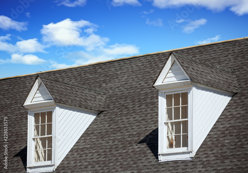 Two White Dormers on Grey Shingle Roof