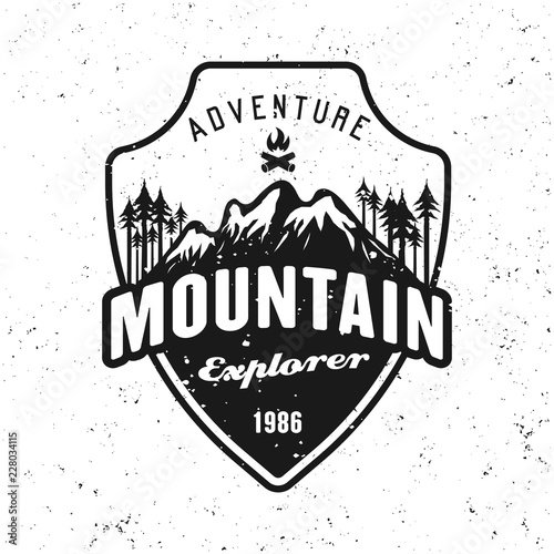 Mountains and forest black vector badge on white