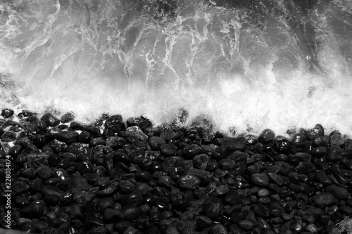 Ocean waves crashing on shoreline rocks