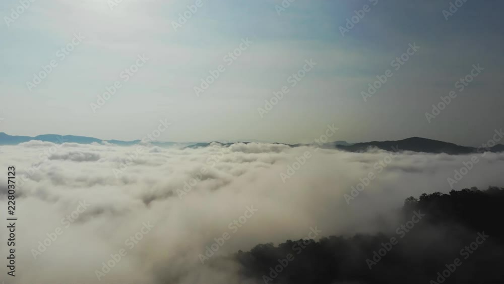Landscape of Morning Mist with Mountain Layer at north of Thailand. Aerial View. Flying over the high mountains in beautiful clouds . Aerial camera shot. Landscape of Morning Mist with Mountain Layer at north of Thailand. Aerial View. Flying over the high mountains in beautiful clouds . Aerial camera shot.