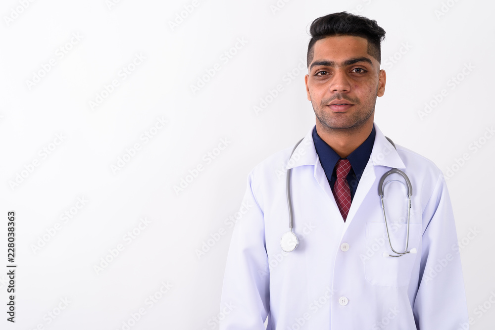 Young Indian man doctor against white background Young Indian man doctor against white background
