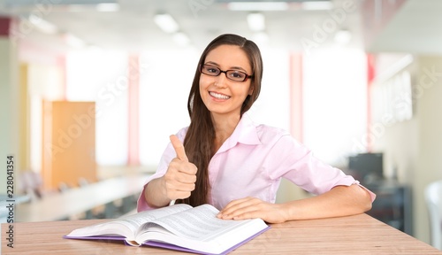 Young female student in library