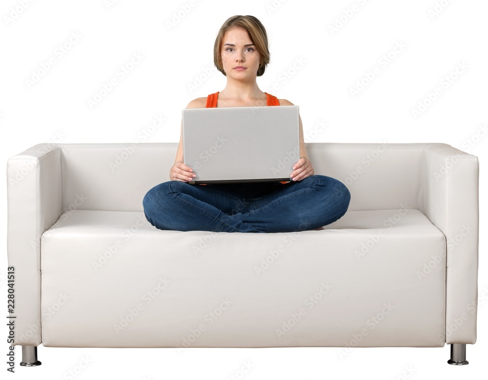 Portrait of a Woman Using her Laptop on a Couch Portrait of a Woman Using her Laptop on a Couch