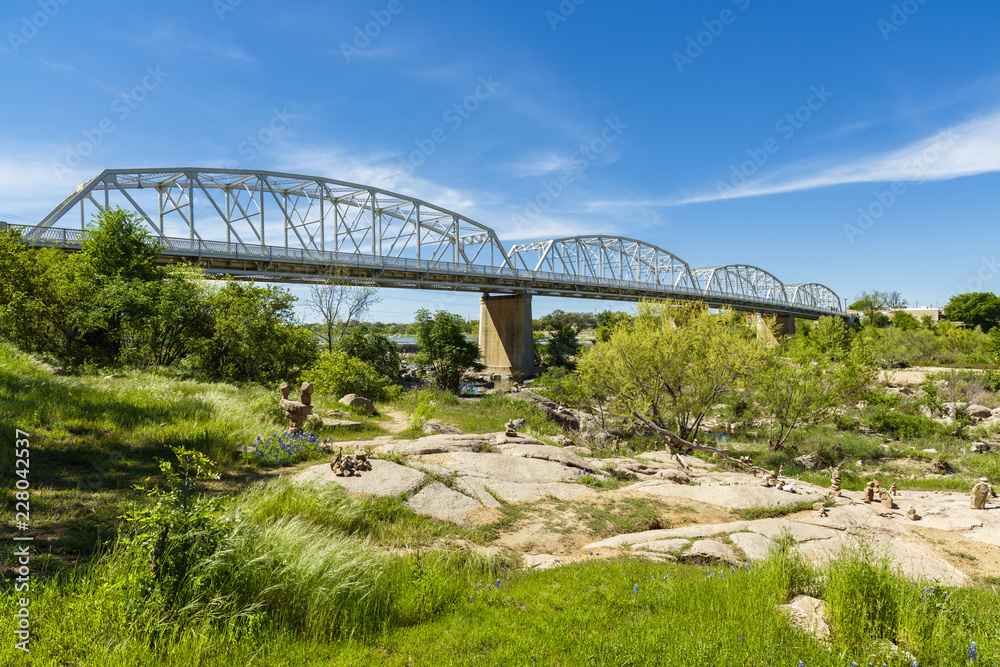 The rustic Highway 71 bridge over the Llano River in the small Texas Hill Country town of LLano. The rustic Highway 71 bridge over the Llano River in the small Texas Hill Country town of LLano.