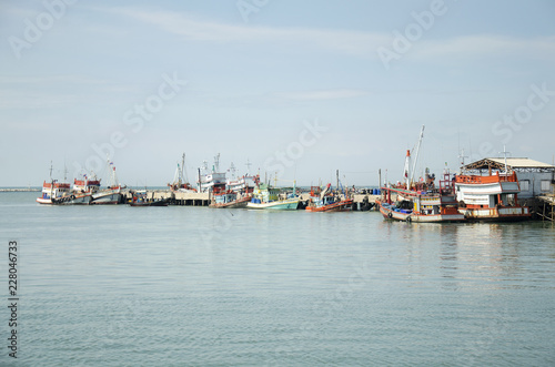 Fishing boat and ship floating in the sea for waiting fishing in night time at Ang Sila in Chonburi, Thailand © tuayai