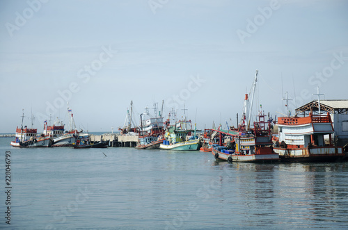 Fishing boat and ship floating in the sea for waiting fishing in night time at Ang Sila in Chonburi, Thailand